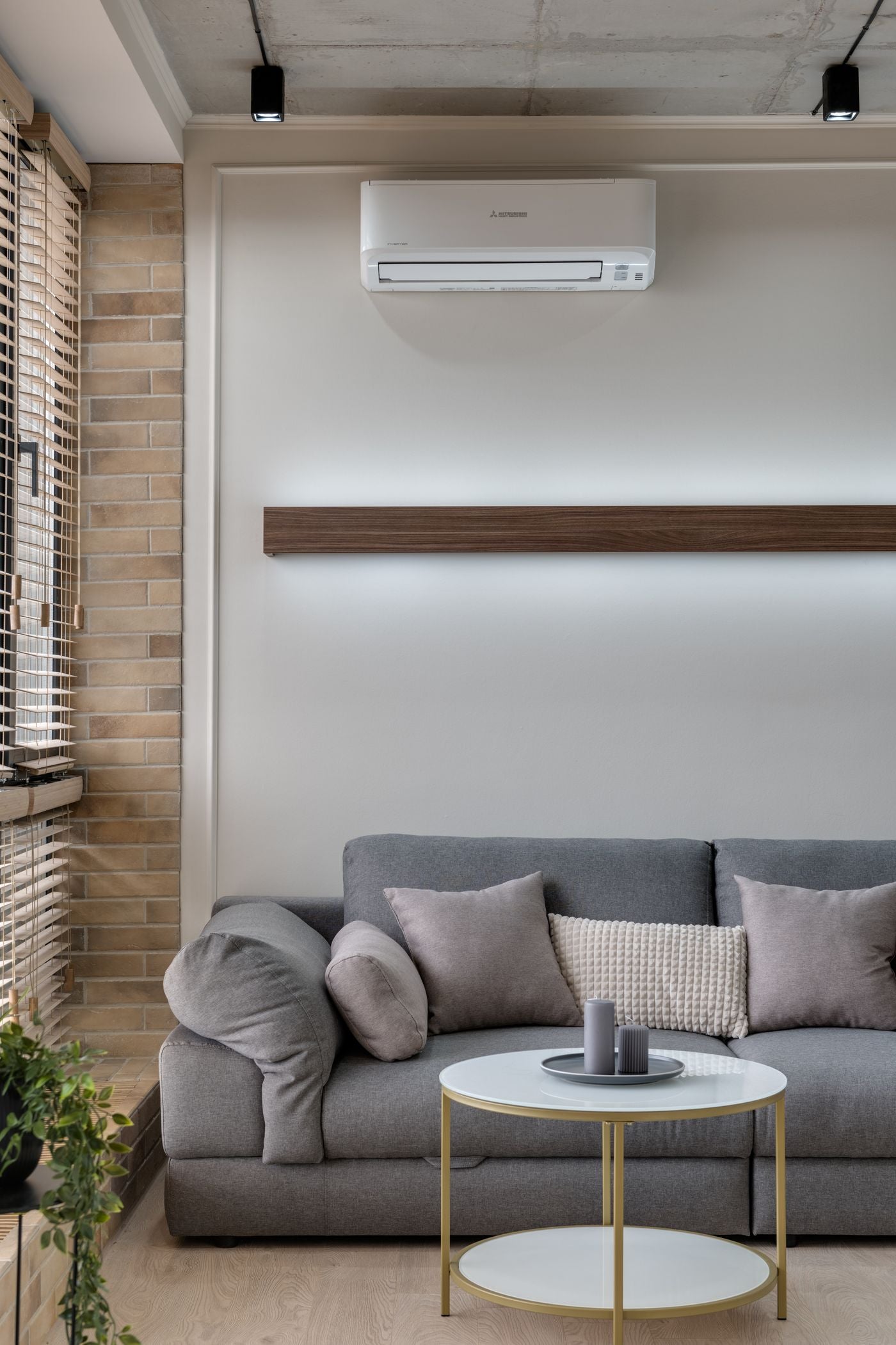 A comfortable living room with a wall-mounted air conditioner